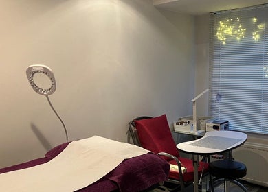 Tranquil treatment room at Delight Laser Spa, New Barnet, England, GB, featuring serene decor and spa equipment.