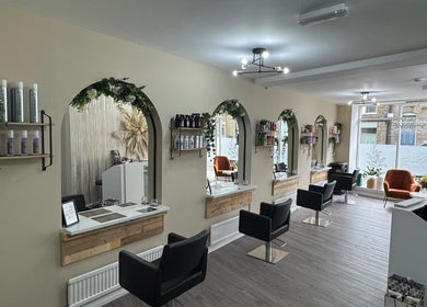 Bright, inviting Jessie’s Hair Lounge interior in Whaley Bridge, England, GB with modern decor and styling stations.