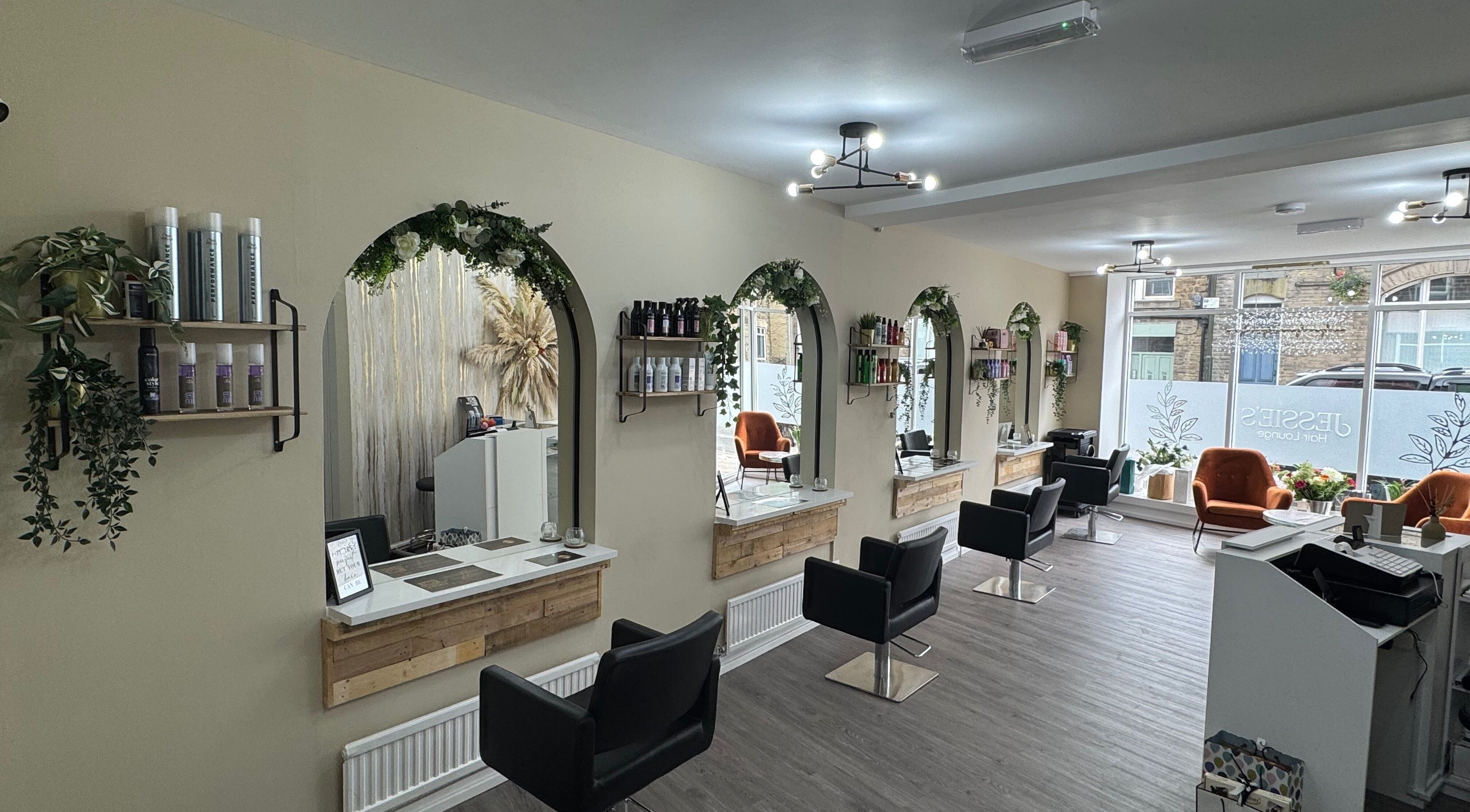 Bright, inviting Jessie’s Hair Lounge interior in Whaley Bridge, England, GB with modern decor and styling stations.