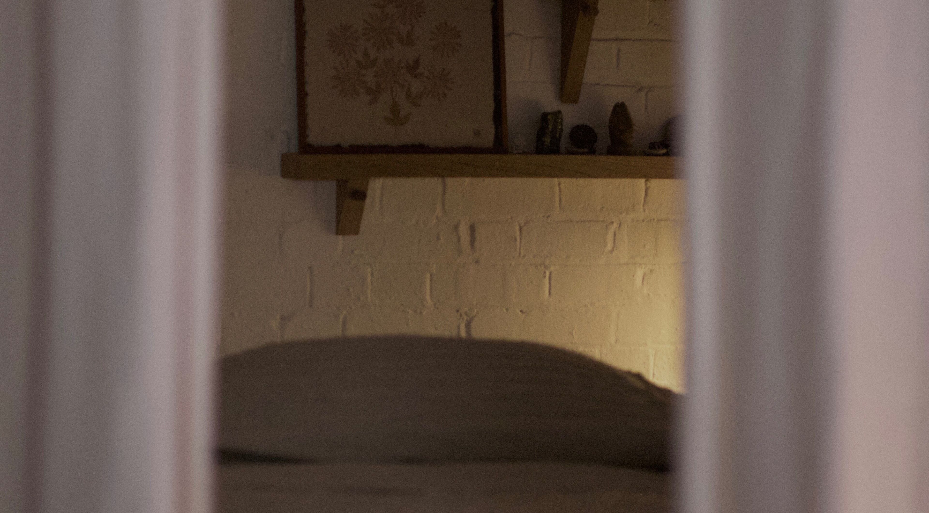 Tranquil corner at Alchème Sanctuary, London, England, GB with soft lighting and calming decor.