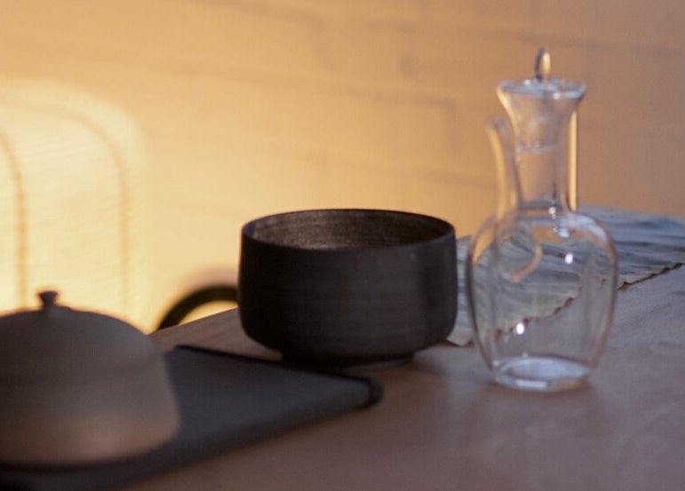 Elegant tableware set at Alchème Sanctuary in London, England, GB, showcasing relaxation ambiance.