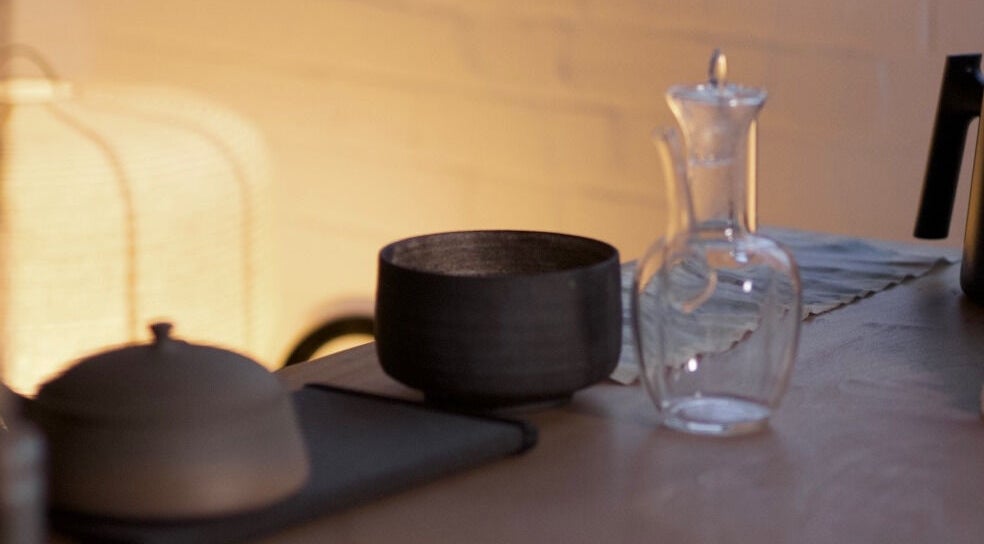 Elegant tableware set at Alchème Sanctuary in London, England, GB, showcasing relaxation ambiance.