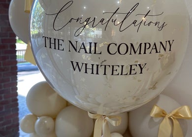 Elegant congratulatory balloon display at The Nail Company Whiteley, Whiteley, England, GB.