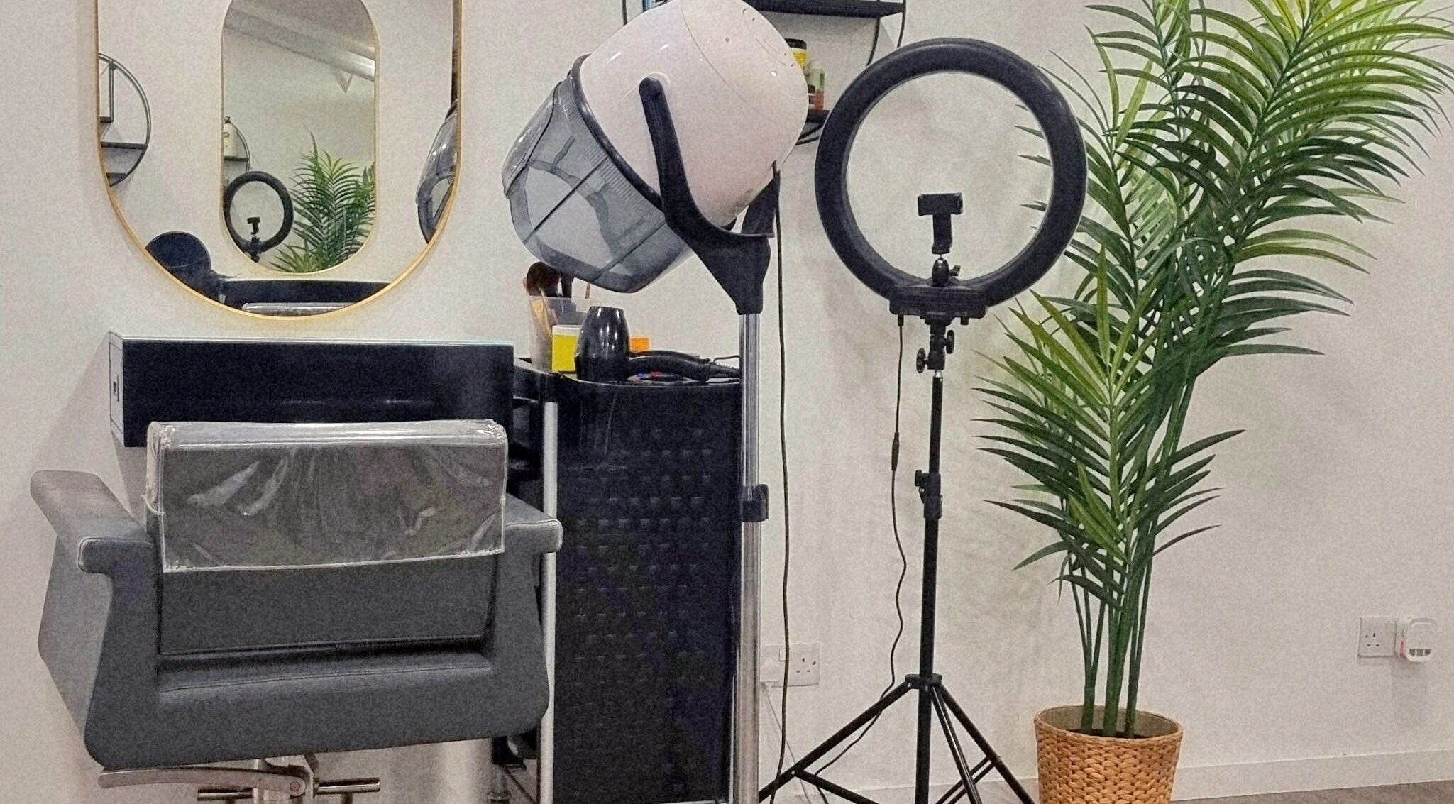 Salon chair and equipment at Devinerootz Salon, Grays, England, GB. Modern and stylish beauty workspace.