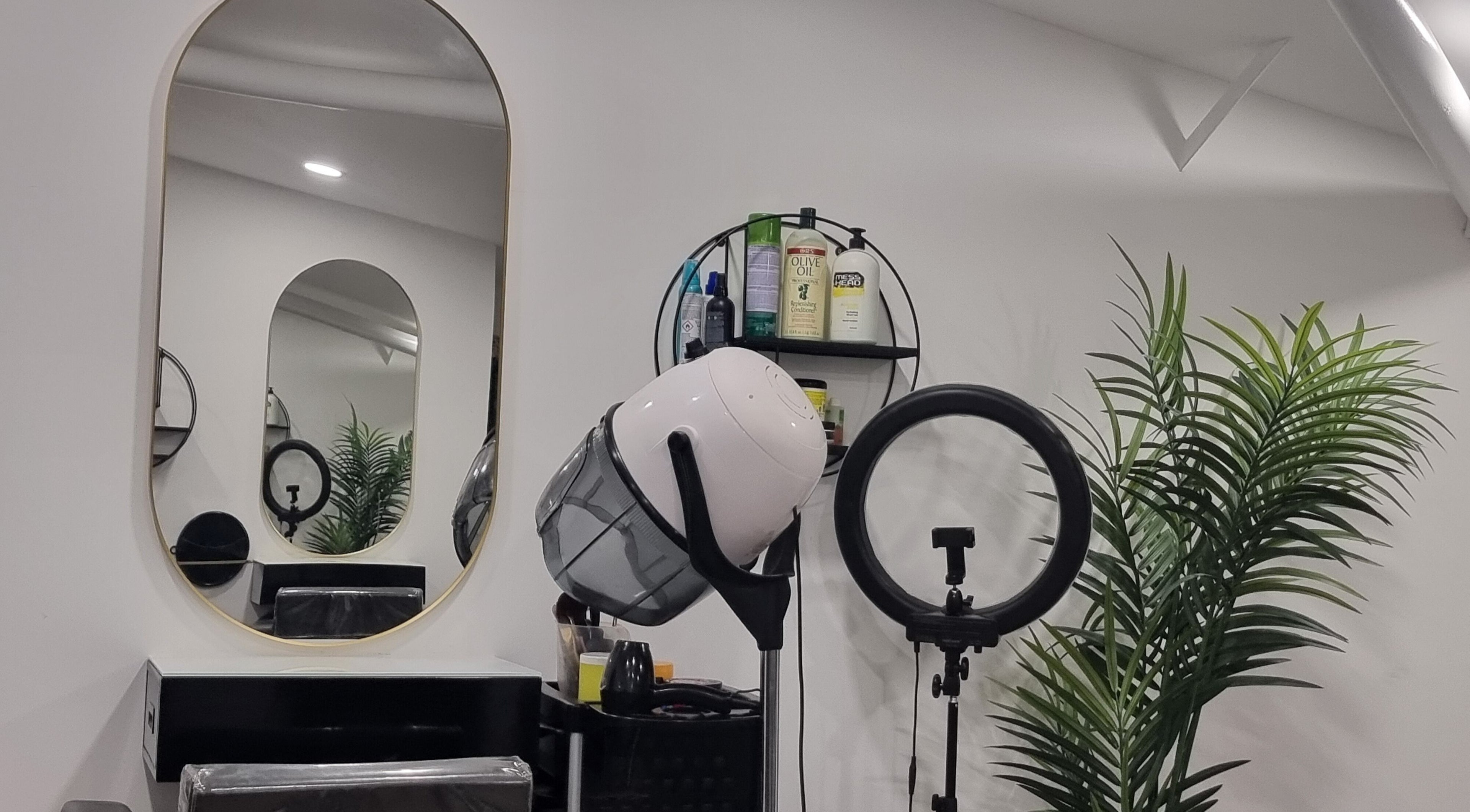 Devinerootz Salon in Grays, England, GB, featuring modern styling chair, mirror, and drying equipment.