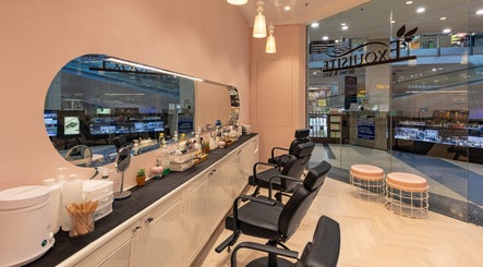 Interior of Exquisite Brows Eastgardens, New South Wales, AU, showcasing sleek chairs and beauty essentials.