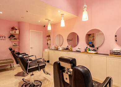 Modern spa with stylish chairs and mirrors at Exquisite Brows and Spa Liverpool in New South Wales, AU.