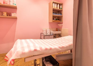 Cozy treatment room at Exquisite Brows and Spa Warringah Mall, Brookvale, New South Wales, AU with soothing pink decor.
