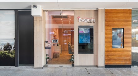 Entrance of Exquisite Brows and Spa Warringah Mall, Brookvale, New South Wales, AU with glass doors and signage.