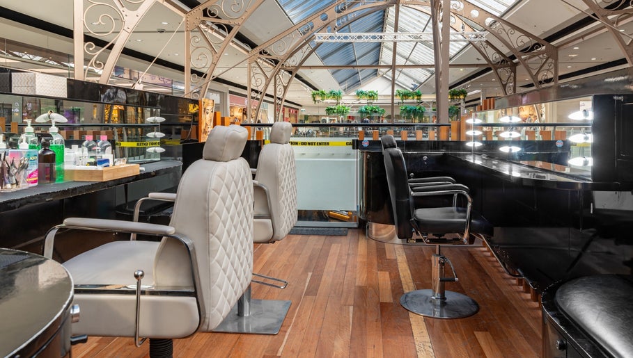 Chic salon interior at Exquisite Brows and Spa Broadway, Glebe, New South Wales, AU with modern styling chairs.