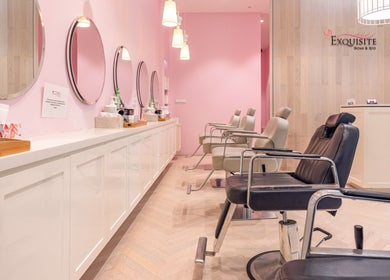 Sleek interior of Exquisite Brows and Spa Miranda, New South Wales, AU with stylish spa chairs and pink accents.