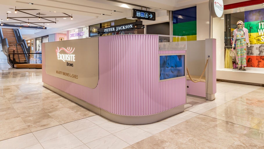 Exquisite Brows Hurstville salon interior in Hurstville, New South Wales, AU. Elegant pink design in shopping center.