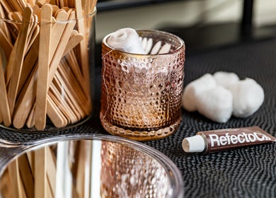 Beauty tools at Exquisite Brows Hurstville, Hurstville, New South Wales, AU including sticks, mirror, and tint.