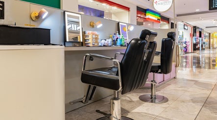 Exquisite Brows Hurstville salon chairs and mirrors in modern, inviting setup at Hurstville, New South Wales, AU.