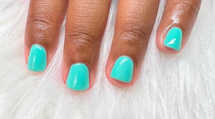 Turquoise manicure at Luxe Studio, Christ Church, BB on a plush white surface.