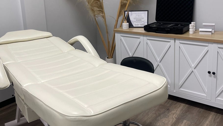 Sifa Skin Haven in Canning Vale offers a calming treatment room with a plush white therapy bed.