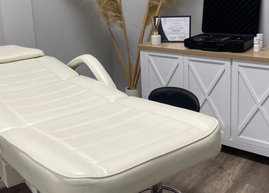 Sifa Skin Haven in Canning Vale offers a calming treatment room with a plush white therapy bed.
