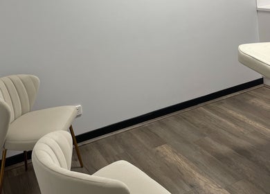 Tranquil treatment room at Sifa Skin Haven, Canning Vale, Western Australia, AU, featuring cozy chairs and bed.