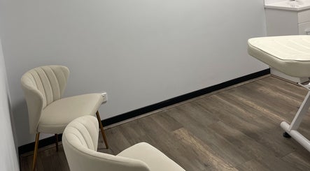 Tranquil treatment room at Sifa Skin Haven, Canning Vale, Western Australia, AU, featuring cozy chairs and bed.