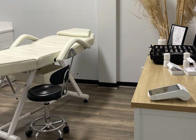 Treatment bed in Sifa Skin Haven, Canning Vale, Western Australia, AU with essential oils on a wooden counter.