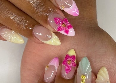 Floral nail art at Nailzbybrenisbel in Rockville, Maryland, US. Elegant and artistic nail designs with vibrant colors.