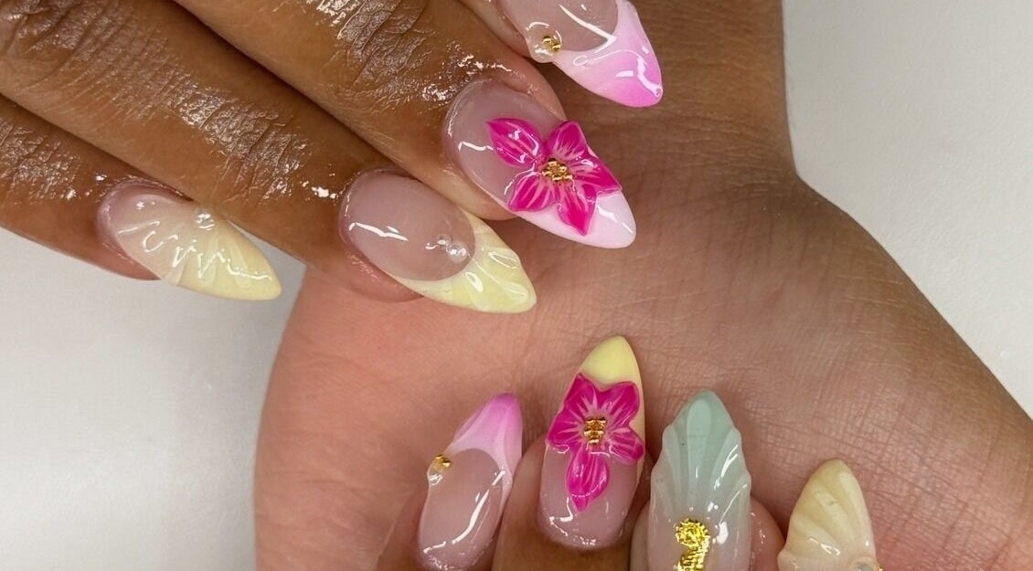 Floral nail art at Nailzbybrenisbel in Rockville, Maryland, US. Elegant and artistic nail designs with vibrant colors.