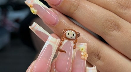 Custom monkey-themed nail art at Nailzbybrenisbel, Rockville, Maryland, US, showcasing intricate design.