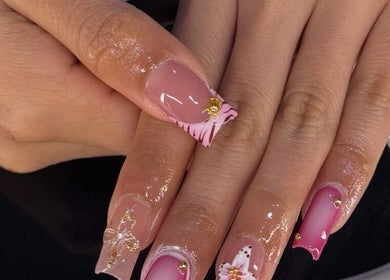 Elegant nail art with pink and gold designs at Nailzbybrenisbel, Rockville, Maryland, US.