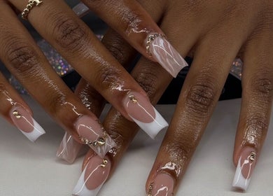 Elegant gel nails with gold accents at Nailzbybrenisbel, Rockville, Maryland, US.