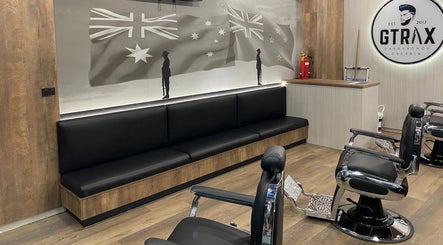 Interior view of Gtrax Barbershop in Dakabin, Queensland with modern barber chairs and seating.