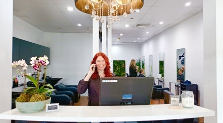 Welcoming reception at Imaj For Hair, Gympie QLD, Queensland, AU with chandelier and vibrant decor.