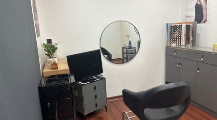 Cozy salon corner at Mohit hairdresser, Gosnells, Western Australia, AU with modern decor and styling tools.
