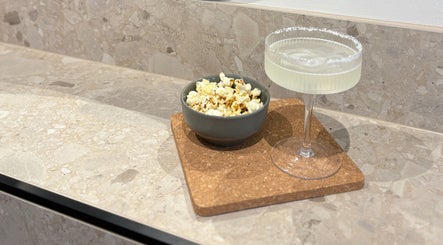 Elegant bowl of popcorn and margarita on a countertop at Hair with Amiee, Manoora, Queensland, AU.