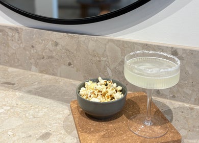 Cocktail and popcorn at Hair with Amiee, Manoora, Queensland, AU, creating a stylish ambiance.