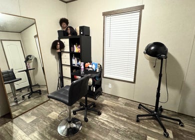 Chic salon area at NUTRÉ, Lake Worth, Florida, US, featuring styling chairs and hair care products.