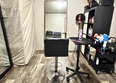 Elegant salon setup at NUTRÉ, Lake Worth, Florida, US featuring modern styling chair and beauty products.