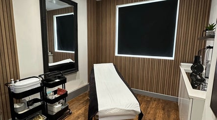 Tranquil treatment room at PAB, Newcastle upon Tyne, England, GB featuring a massage bed and modern decor.