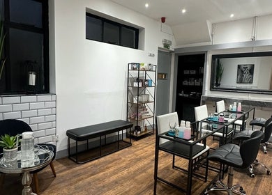 Modern nail salon at PAB, Newcastle upon Tyne featuring sleek chairs, nail tables, and decor.