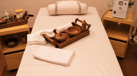Tranquil spa setup at NIja Luxury Wellness, Colombo, Western Province, LK featuring a massage table and amenities.