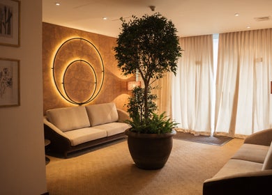 Elegant lounge at NIja Luxury Wellness, Colombo, Western Province, LK, featuring plush sofas and ambient lighting.