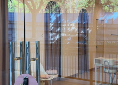 View through glass entrance of WAXING BY GIRL ENTERPRISE, Petaling Jaya, Selangor, MY with tranquil interior.