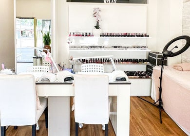 Cozy nail station at Studio Giulia, Zürich, CH featuring manicure setup and nail polish selection.