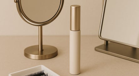 Elegant beauty products and mirror at Refined by Leah, Manchester, England, GB, showcasing a stylish vanity setup.