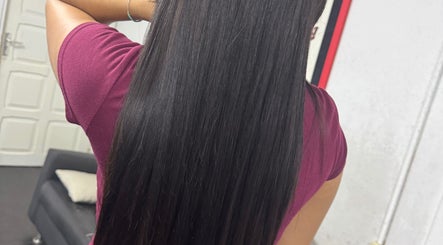 Smooth, straightened hair at Nova Beauty Lab, Paramaribo, SR, showcasing sleek styling in a salon setting.