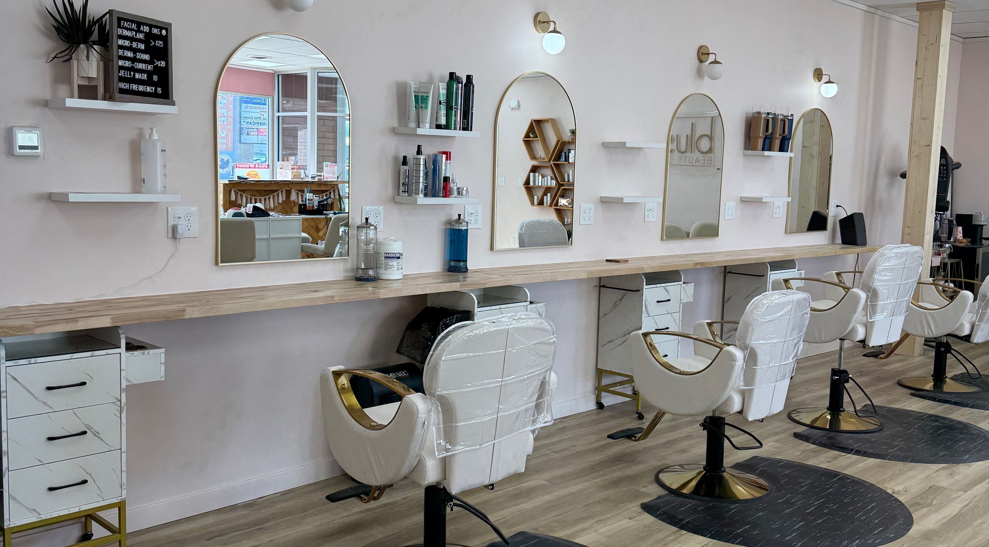 Interior of Blush Beauty Spa in Pocatello, Idaho, US with stylish salon chairs and mirrors.