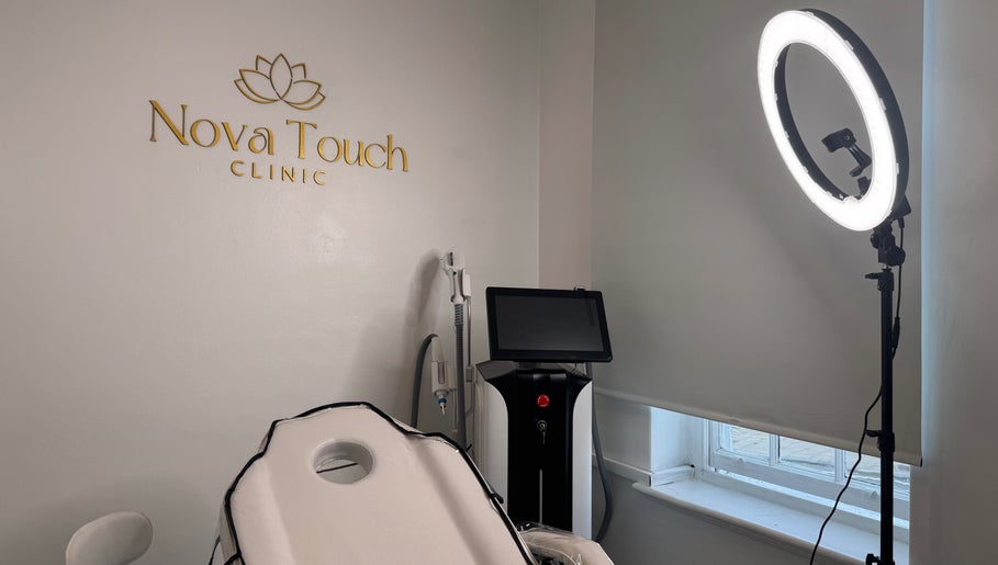 Nova Touch Clinic treatment room in Edgware, England featuring equipment and ring light setup.