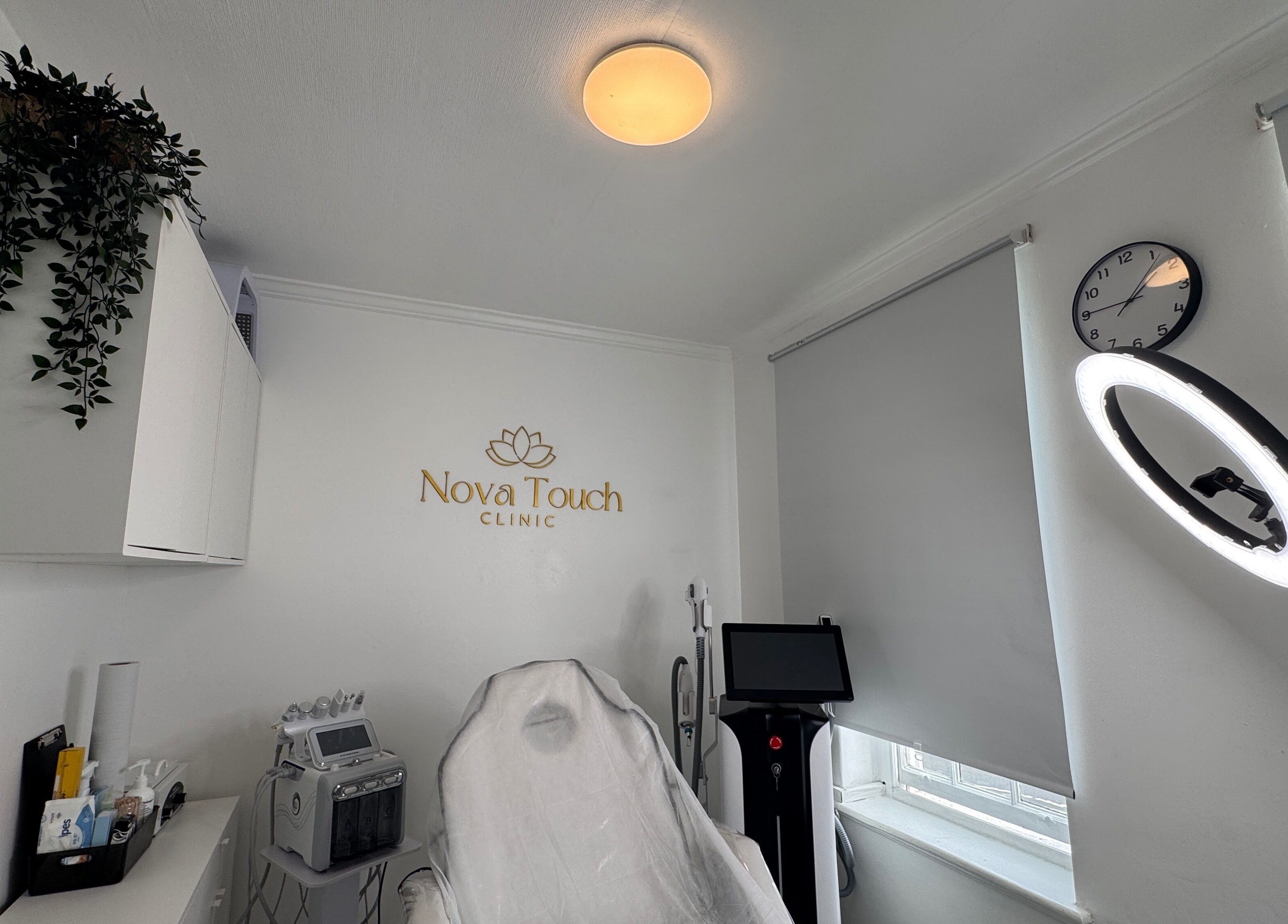 Treatment room at Nova Touch Clinic, Edgware, England, GB, showcasing modern equipment and soothing ambiance.