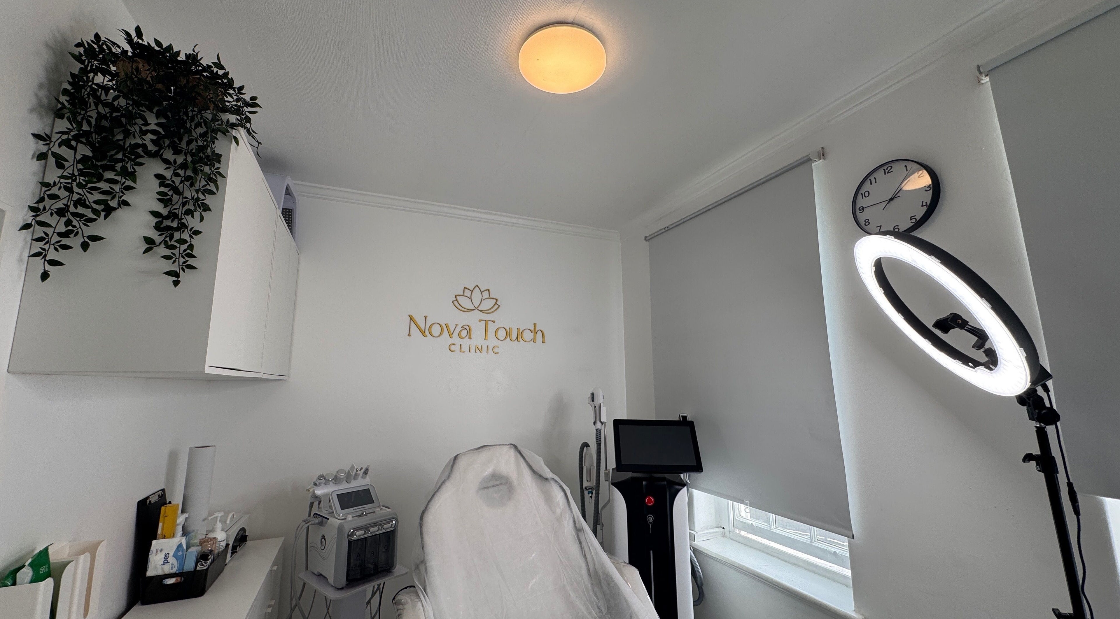 Treatment room at Nova Touch Clinic, Edgware, England, GB, showcasing modern equipment and soothing ambiance.