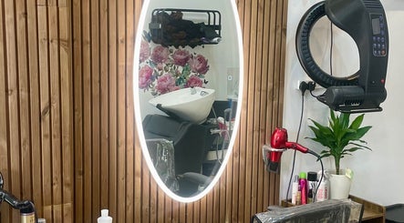 Elegant salon station at Eliabeautystudio Ladies HairSalon, Wembley, England, GB, with styling tools and plant decor.