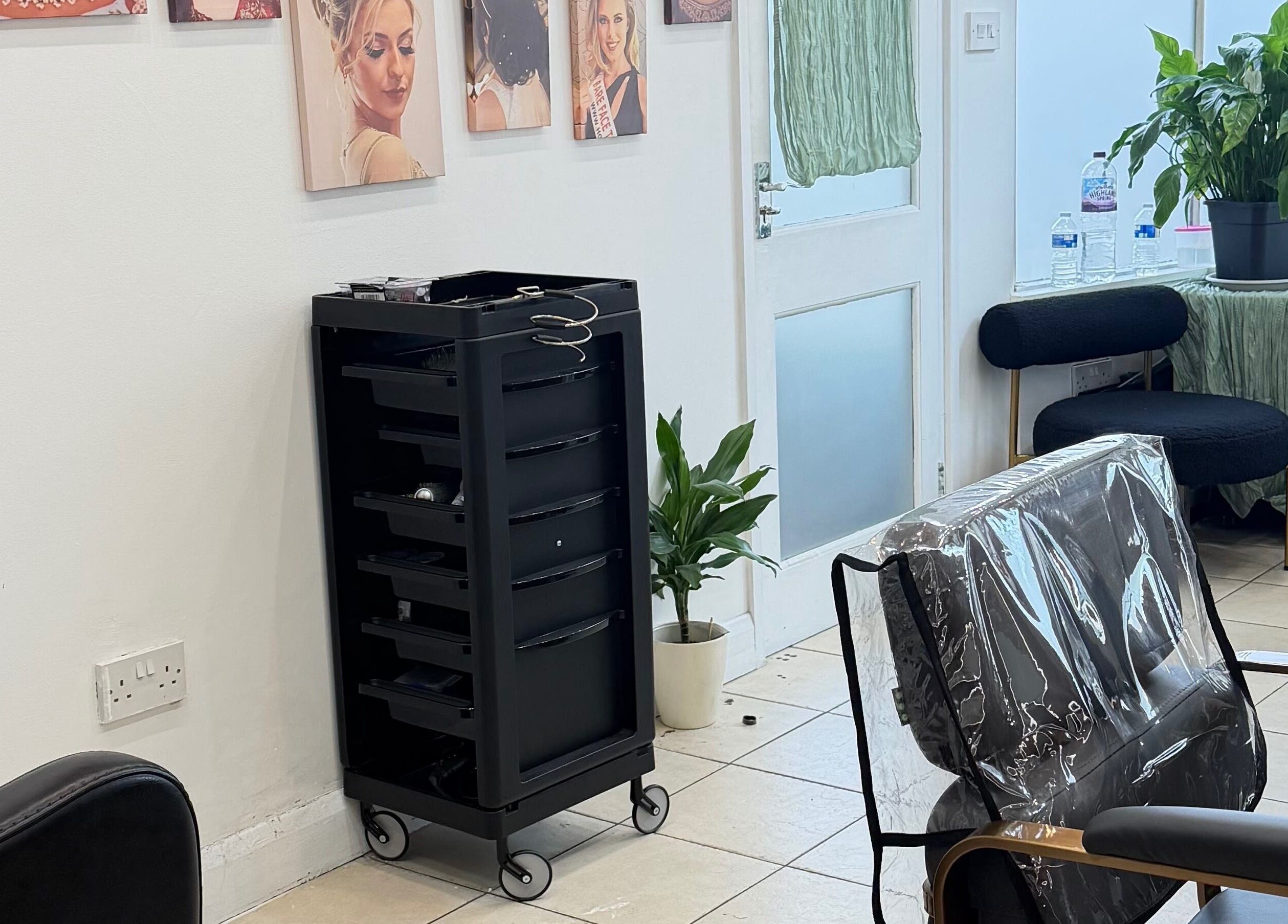 Elegant interior of Eliabeautystudio Ladies HairSalon in Wembley, England, GB with stylish decor and seating.